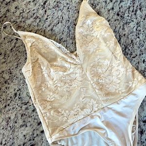 🌈out from under: Urban Outfitters🌈 Lacey low cut beige bodysuit. Size M